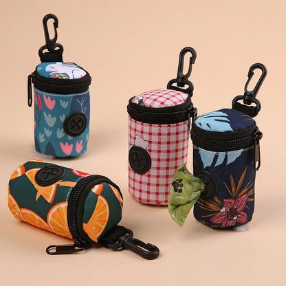 Colorful dog waste bag dispensers with carabiners and various patterns on a beige background