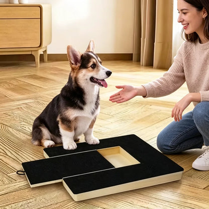Dog using dog nail scratch pad wooden trimming board with woman training pet nails indoors
