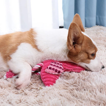 Small dog playing with corduroy squeaky dog toy plush animal-shaped bite-resistant interactive pet toy