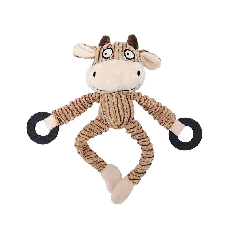 Plush cow dog toy with rope limbs and black chew rings for interactive pet play