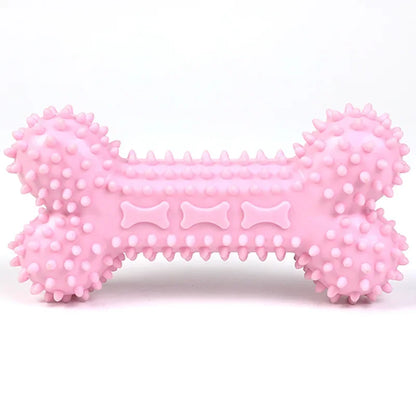 Pink spiked rubber dog chew toy in bone shape on white background