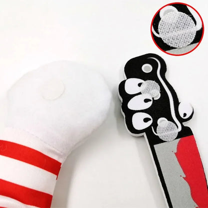 Dog toy with red and white striped sleeve and detachable cartoon knife with Velcro