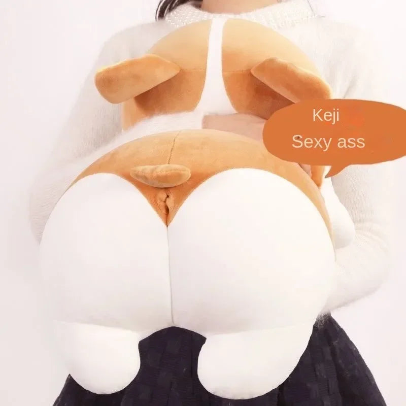 Person holding a plush corgi dog pillow toy with floppy ears and a speech bubble.