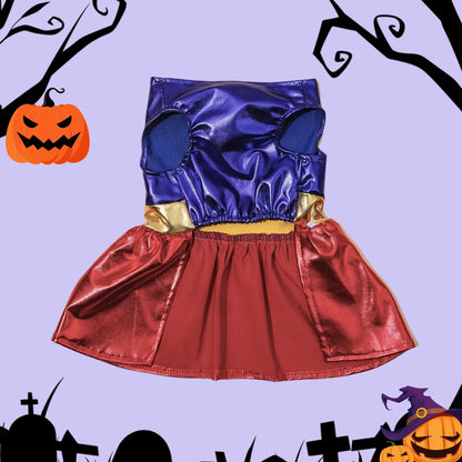 Colorful dog Halloween costume with blue top, red skirt, and gold accents on purple background