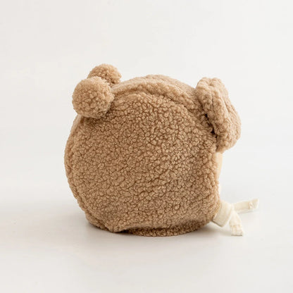 Plush brown dog toy with fluffy ears and textured fleece, perfect for pets