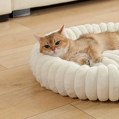 plush donut cat bed with a cozy cat resting on a soft round cream pet nest on a wooden floor