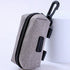 Gray dog waste bag dispenser pouch with zipper and clip for leash attachment