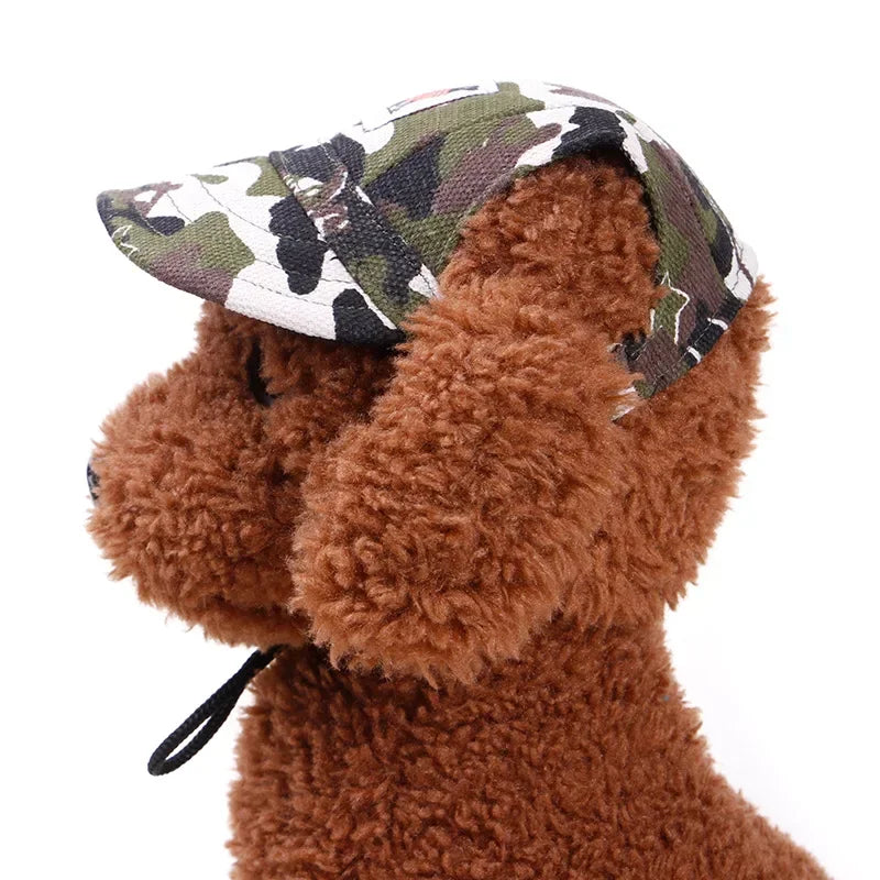 Brown plush dog mannequin wearing a camouflage dog hat with chin strap