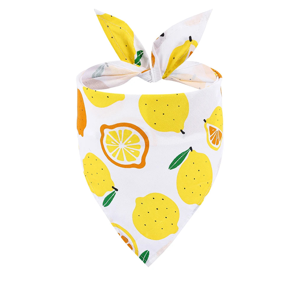 White dog bandana with yellow lemon print and tie knot design, pet accessory.