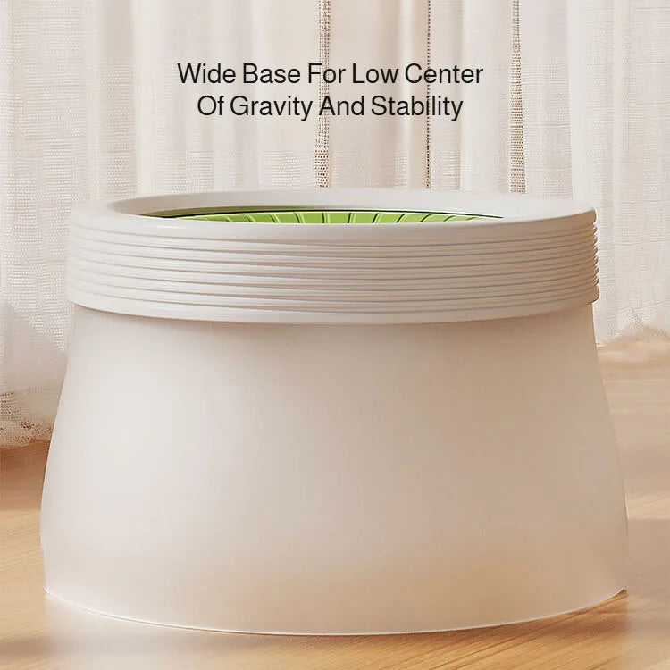 Wide base dog water bowl with stable design on wooden floor, featuring green interior.