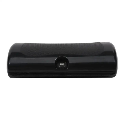 Black pet deshedding brush with ergonomic handle for removing dog and cat hair, multifunctional grooming tool