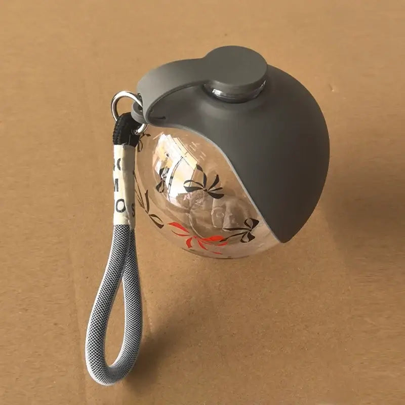 portable dog water bottle gray leak-proof spherical pet drinking fountain with lanyard for outdoor travel