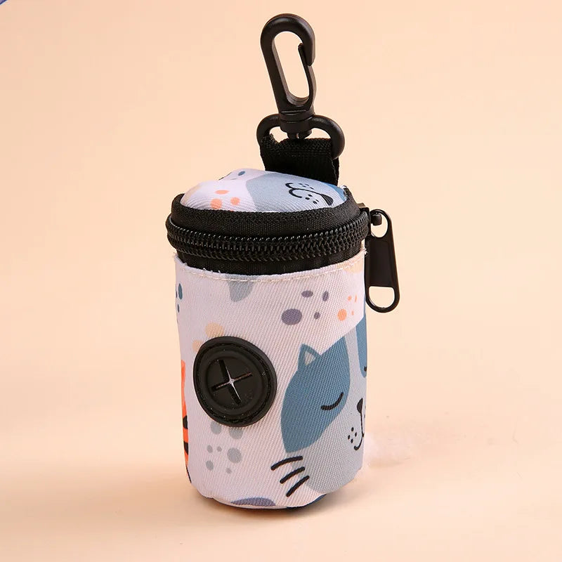 Dog poop bag holder with cartoon cat print, zipper closure, and clip for leash attachment