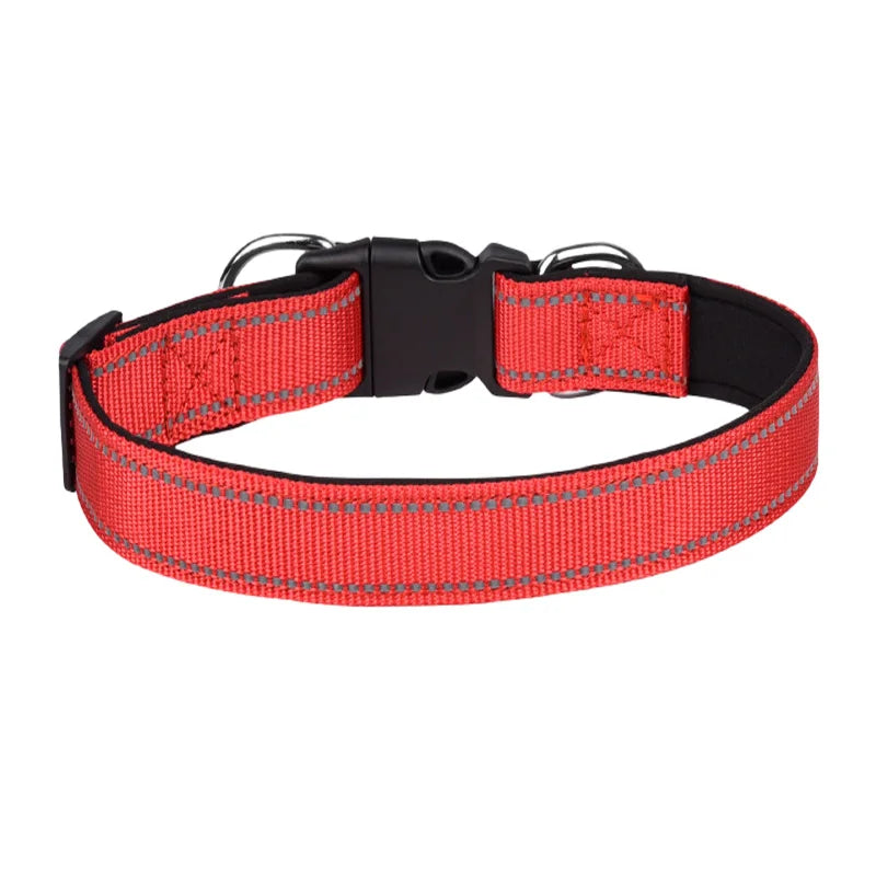 Adjustable red nylon dog collar with black buckle and reflective stitching