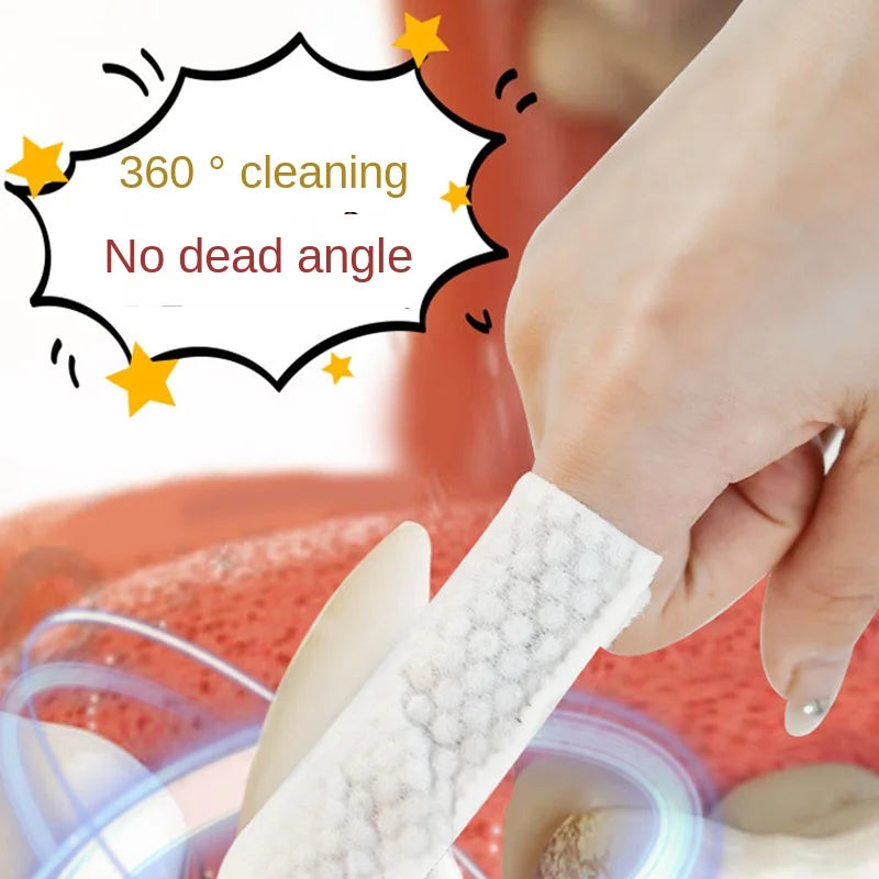 Finger toothbrush cleaning a dog&