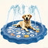 Large dog sitting in a blue splash pad with water fountains and cartoon animal designs.