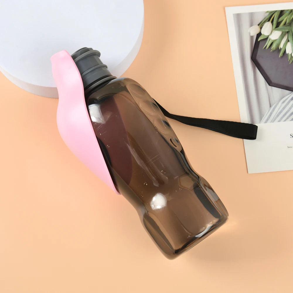 portable dog water bottle with pink foldable bowl and black lanyard for outdoor travel hydration