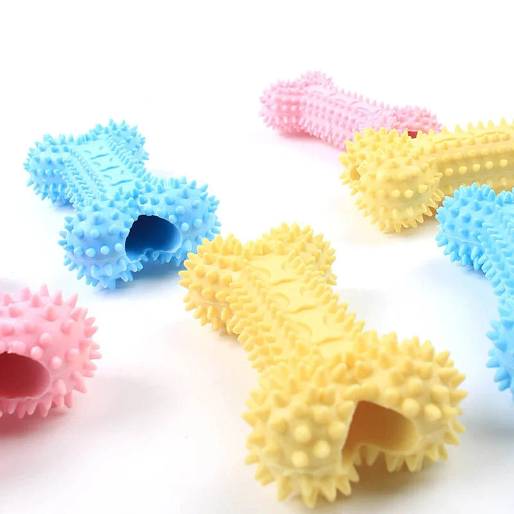 Colorful spiky rubber dog bone toys for chewing and dental health on white background