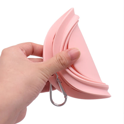 Collapsible pet food water bowl being held, showcasing the portable and foldable design in macaron color.