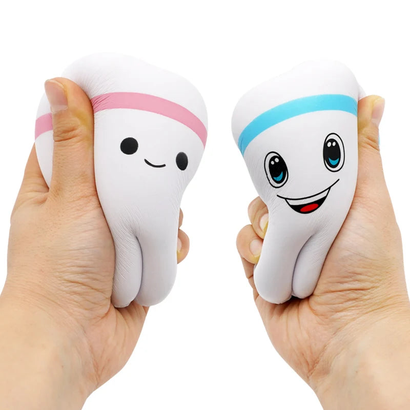 Cute teeth shape squishy toy in hands, slow rising stress relief gift for kids, blue and pink cartoon dental toy