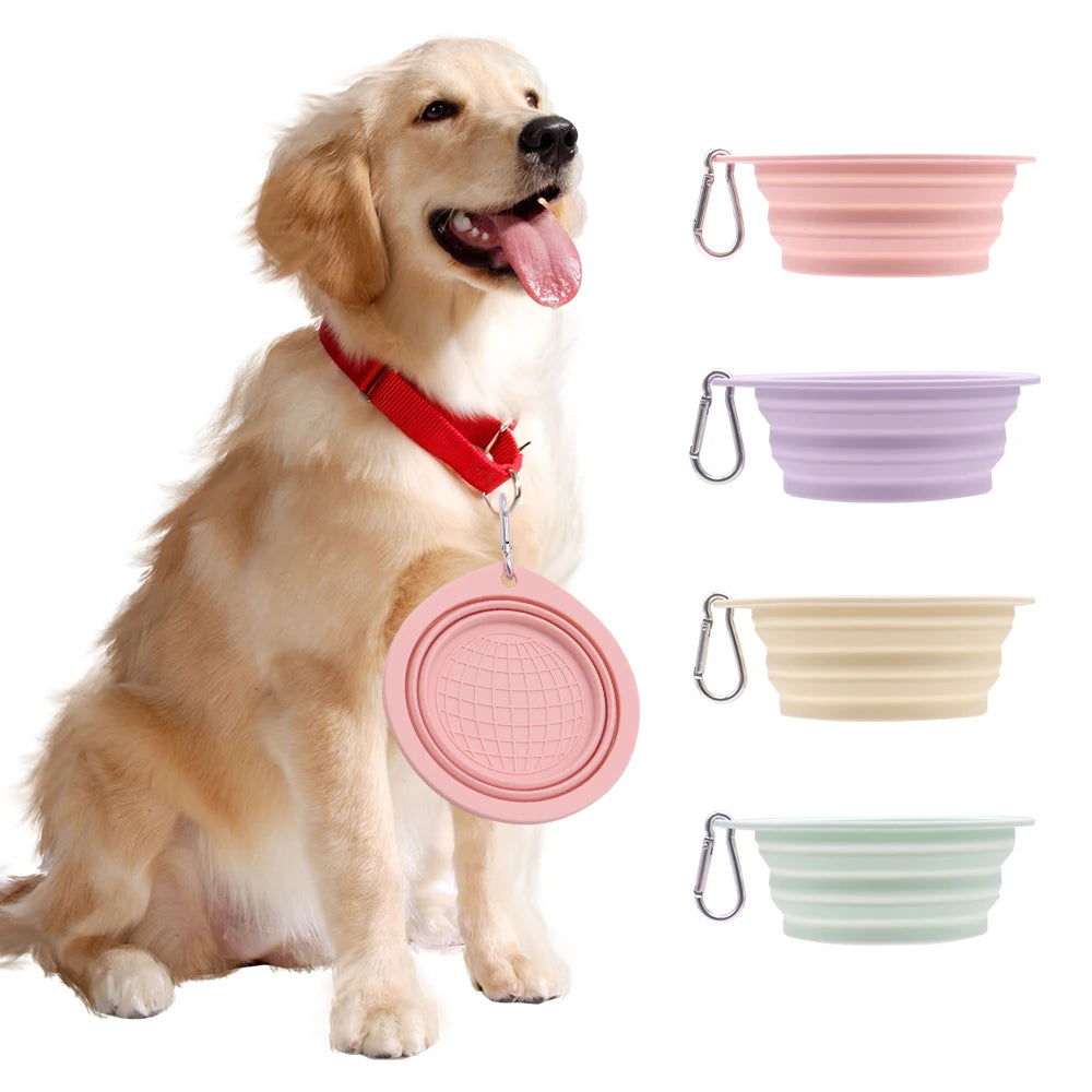Collapsible pet food water bowl in macaron colors with carabiner showcased with a happy dog.