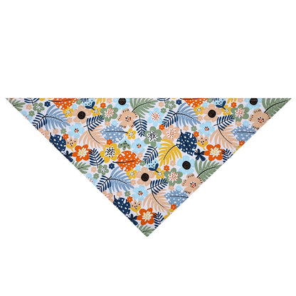Colorful floral dog bandana with blue, orange, yellow, and green leaf pattern on white background