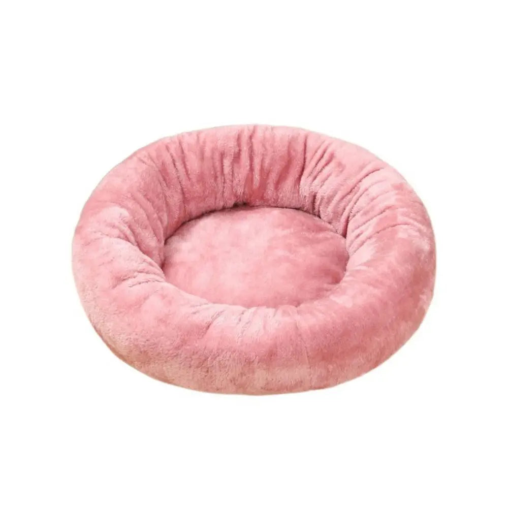 Pink waterproof donut dog bed, soft washable round plush pet bed for dogs, cats, puppies, and kittens