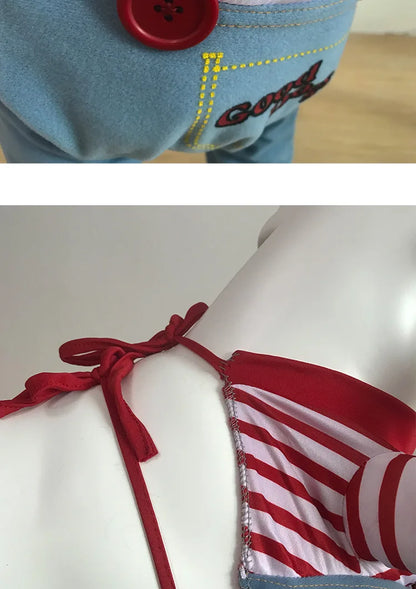 Close-up of dog clothes with red buttons, blue denim fabric, and red striped collar details.
