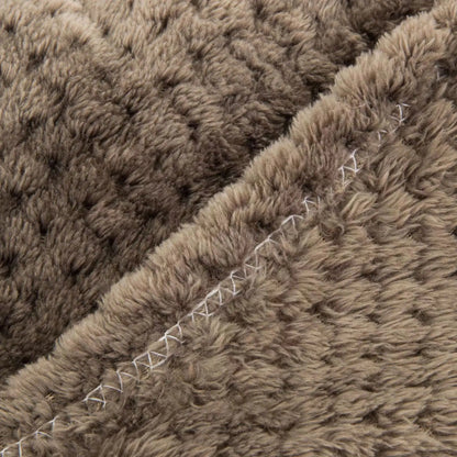 Soft pet blanket close-up of plush brown fur texture with stitched seam for dogs and cats