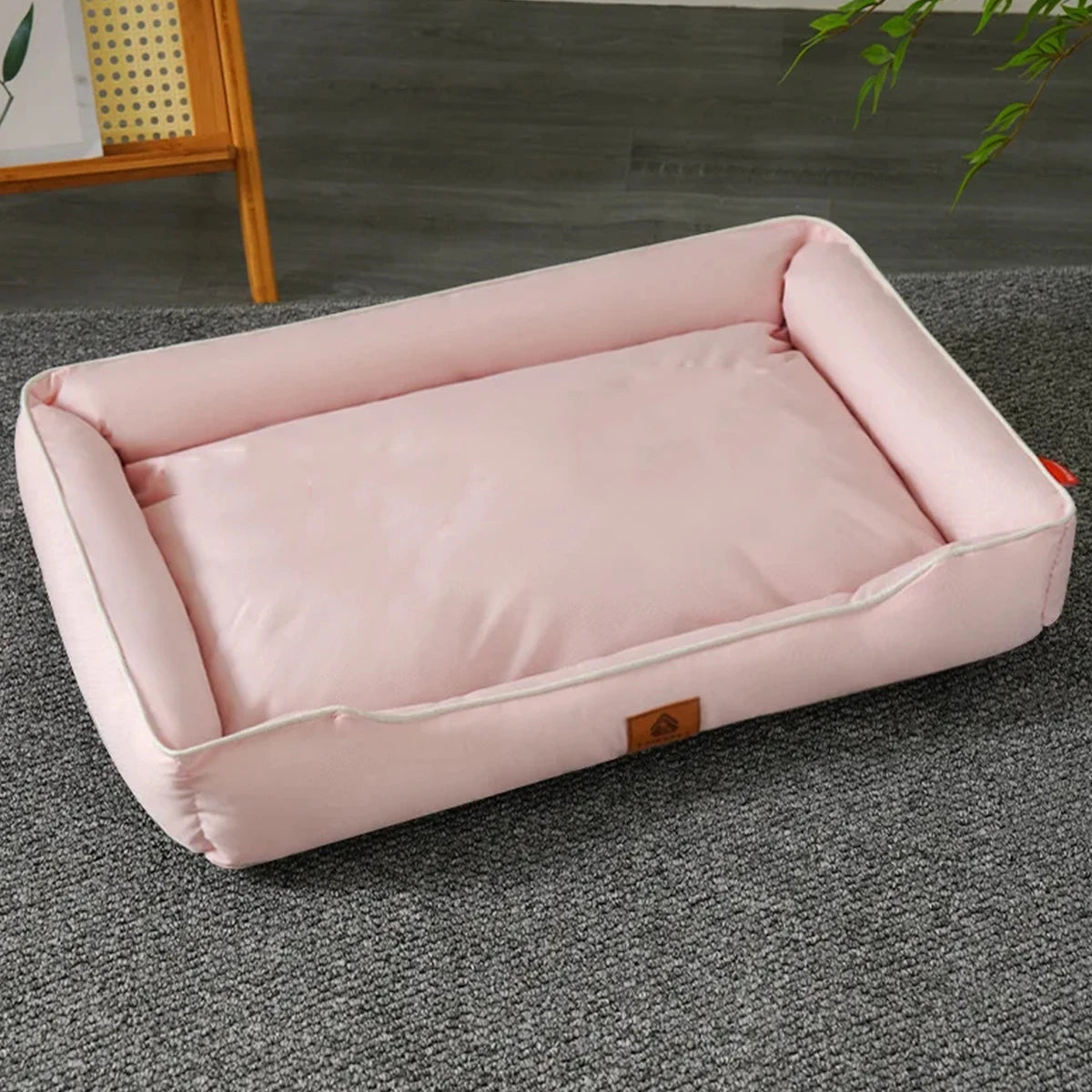 Pink waterproof square dog bed for large dogs with thick padded sofa-style design and non-slip bottom