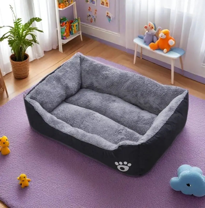 Black plush dog bed with soft gray fleece lining, non-slip base, and bite-resistant sides for large, medium, and small dogs.