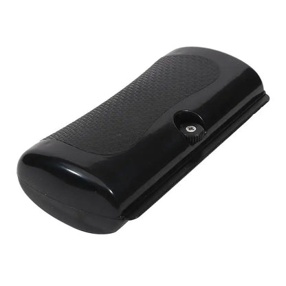 Black pet deshedding brush with ergonomic handle for removing loose dog and cat hair, grooming and shedding control