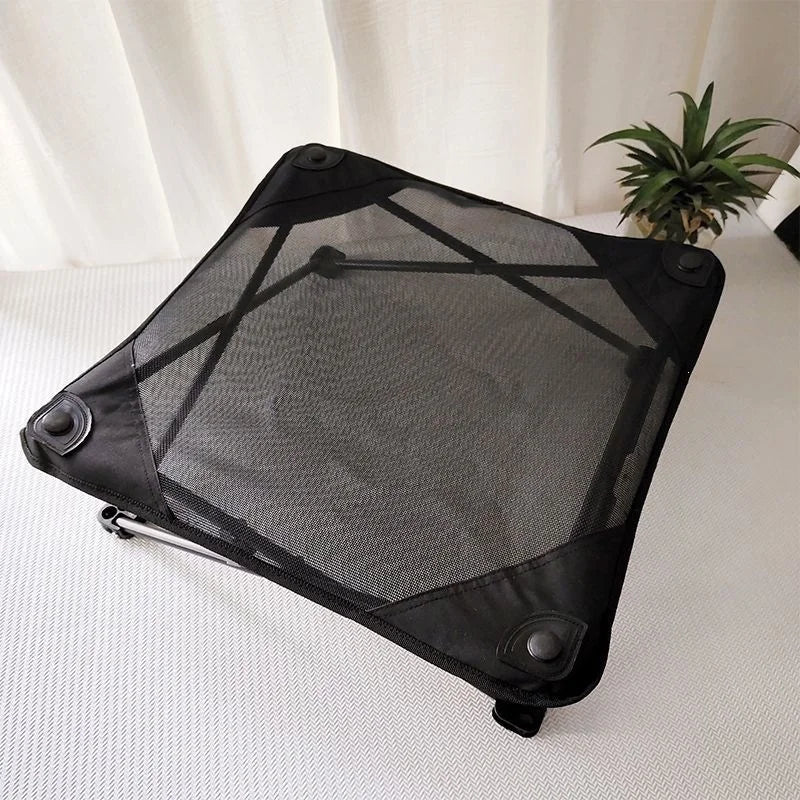 Black waterproof raised mesh dog bed with elevated cooling design for camping, balcony, yard, and garden