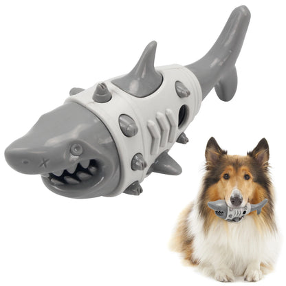 Grey shark-shaped dog chew toy with spiked details, Collie holding the toy in mouth