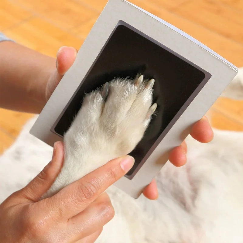 pet handprint and footprint kit for clean, safe dog paw print keepsake in a DIY photo album