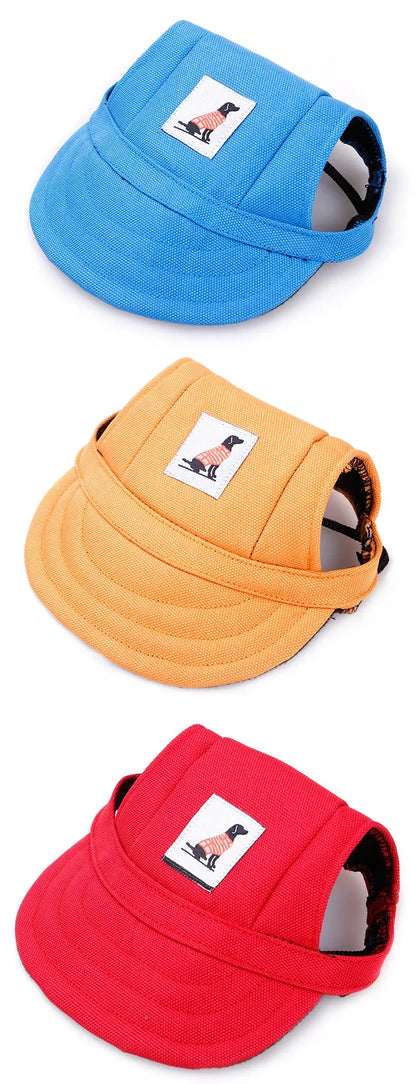 Colorful dog hats in blue, orange, and red with dog patch, pet accessories on white background
