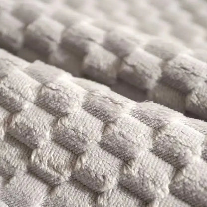 Close-up of soft, textured fabric featuring a patterned weave, ideal for Dog Beds for Large Dogs/autumn and winter Warm Bed Pet Mat.