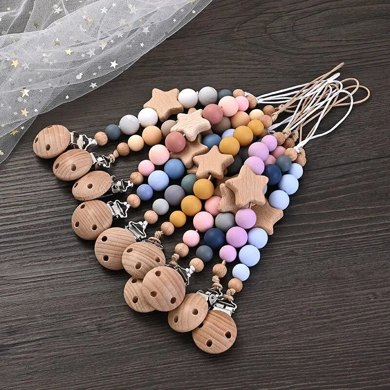 Wooden pacifier clip teether with colorful silicone beads and star-shaped wood design for baby soothing and teething