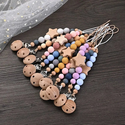 Wooden pacifier clip teether with colorful silicone beads and star-shaped wood design for baby soothing and teething