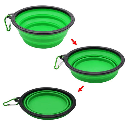 Green collapsible pet travel bowl for dogs and cats, silicone portable water and food bowl with clip for outdoor travel.