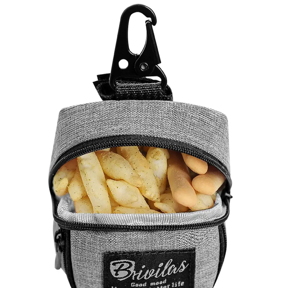 Gray dog treat pouch filled with dog chews and biscuits, featuring a secure clip closure.