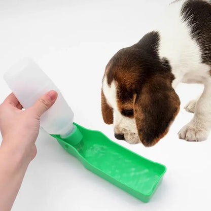 portable dog water bottle for travel, green pet drinking cup with dog drinking water on white background