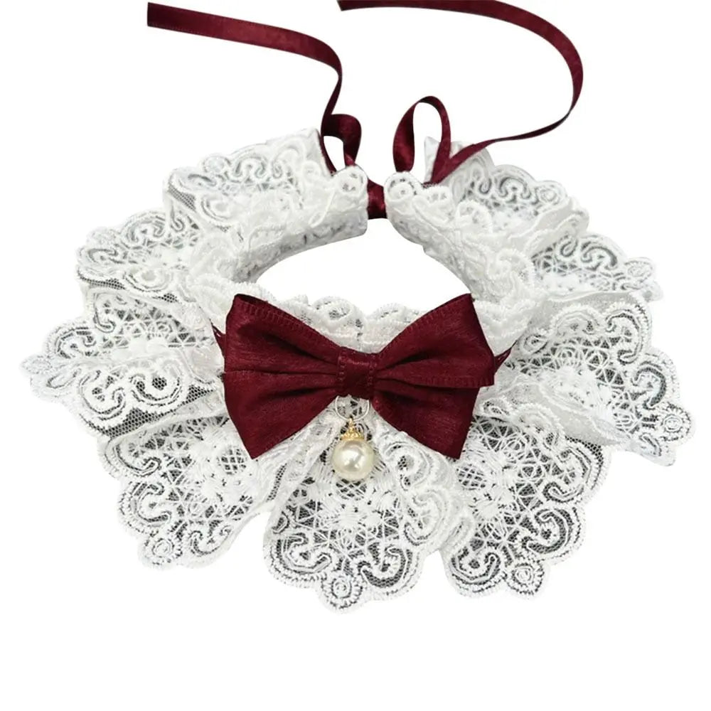 Elegant dog lace collar with burgundy bow, pearl charm, and white floral lace ruffles.