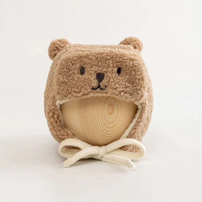 Cute brown fleece dog hat with bear ears and embroidered face, perfect pet winter accessory