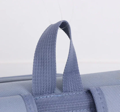 Breathable pet carrier backpack with durable blue nylon handle for cats and small dogs