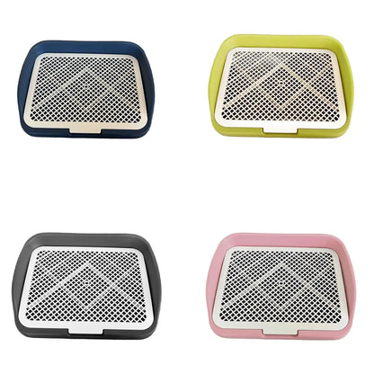 Set of four plastic dog potty training trays in blue, green, gray, and pink.