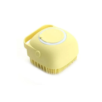 Yellow silicone pet bathing brush with shampoo dispenser, soft massage bristles for dog and cat grooming