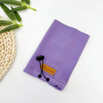 Purple fleece dog apparel accessory with adjustable cord on white background