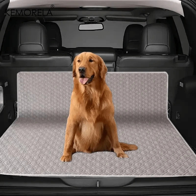 Golden Retriever sitting on a quilted dog car trunk mat protector in SUV