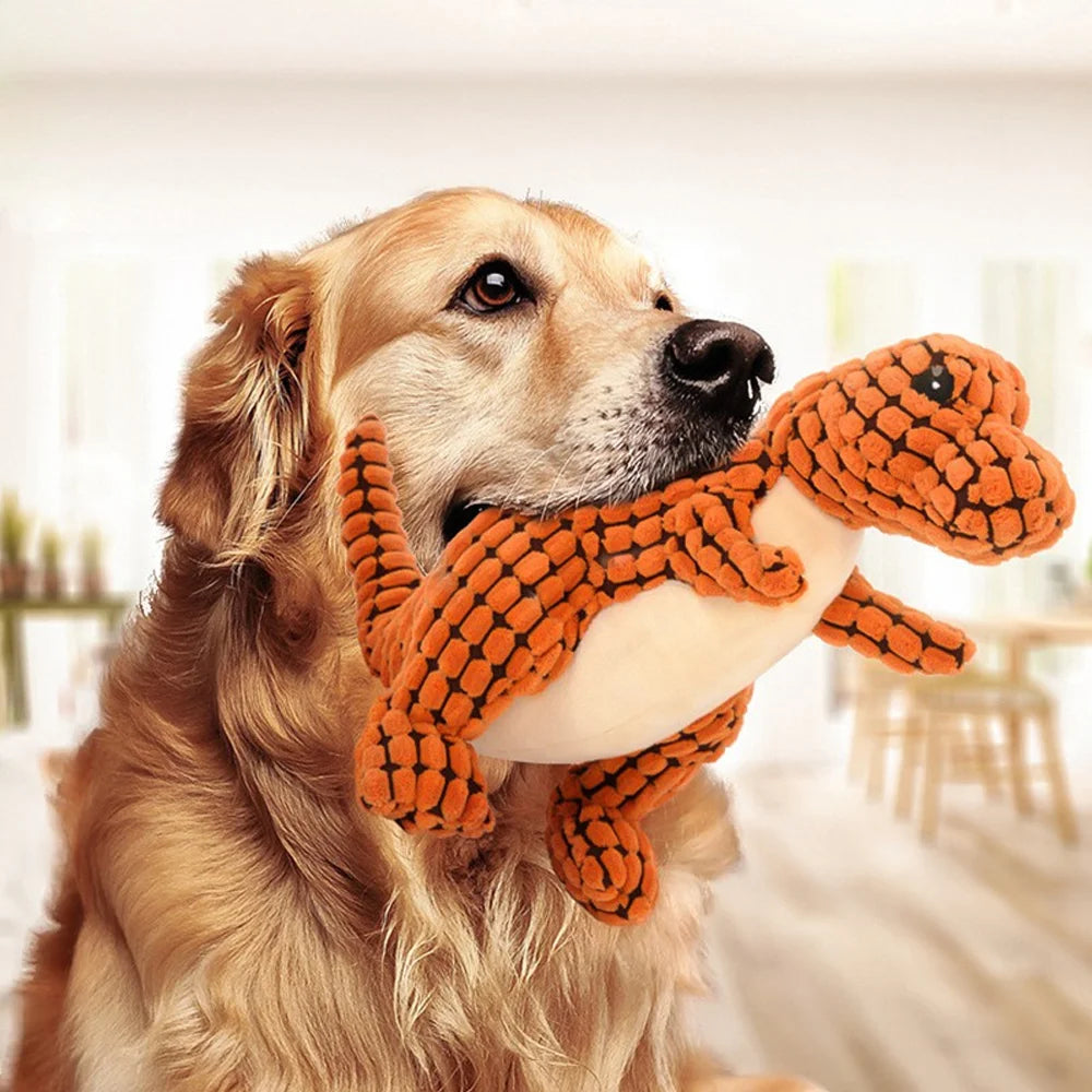 Golden retriever holding plush dinosaur dog chew toy for interactive play, soft chew toy for small dogs